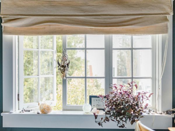 A calm and tidy corner of a room with a yoga mat, ready for a daily ritual.